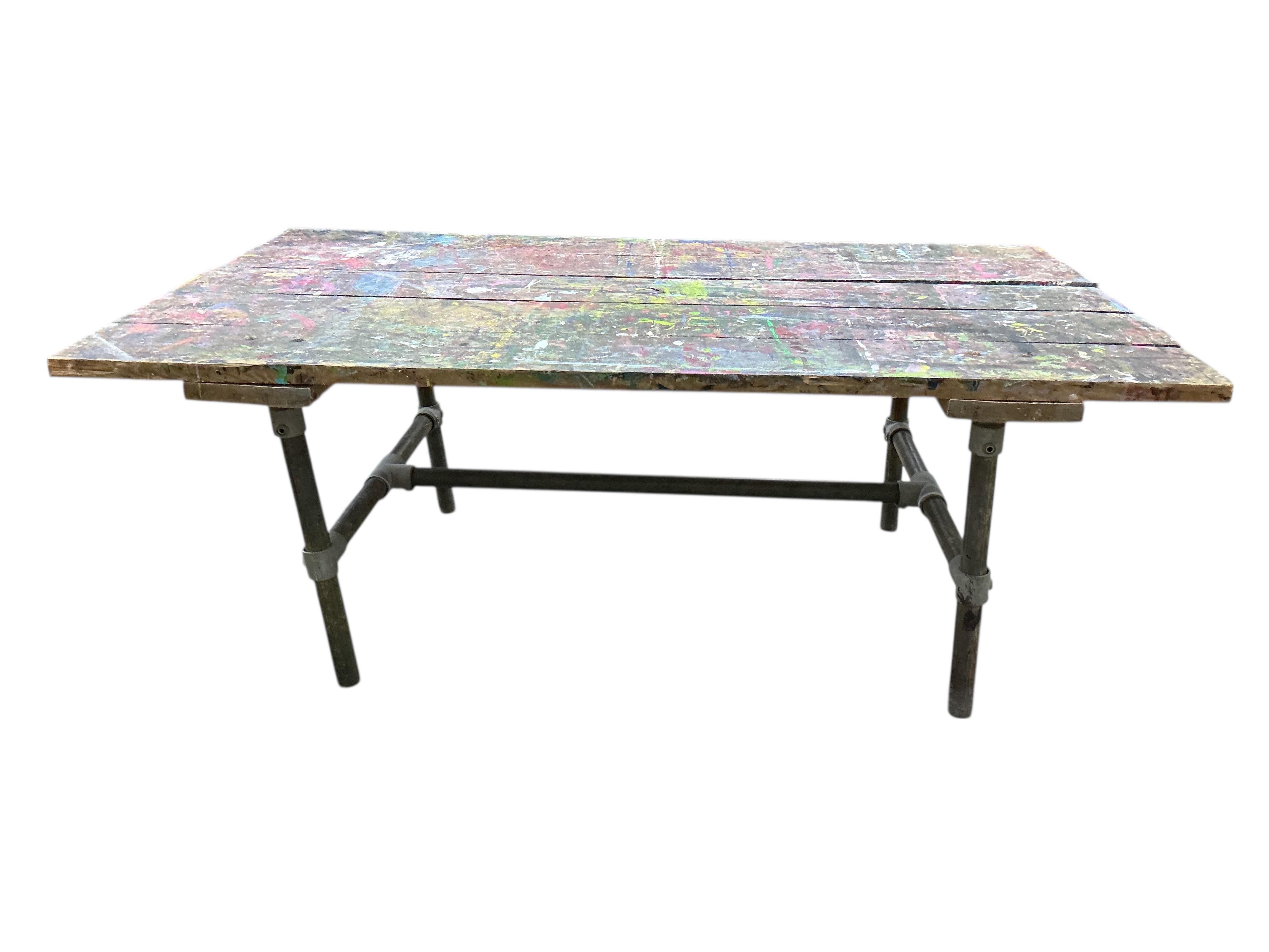 An industrial style rectangular artist's studio work table, width 195cm, depth 112cm, height 75cm